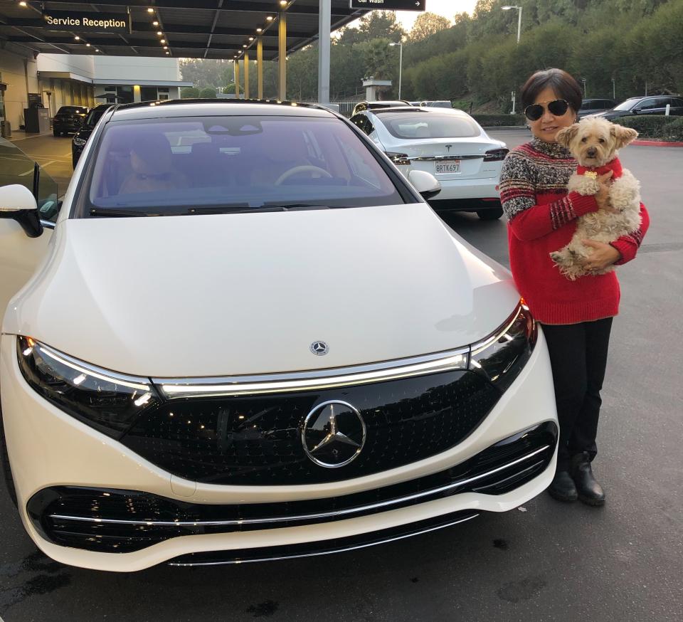 Christine Orita and her Mercedes-Benz EQS 450+.