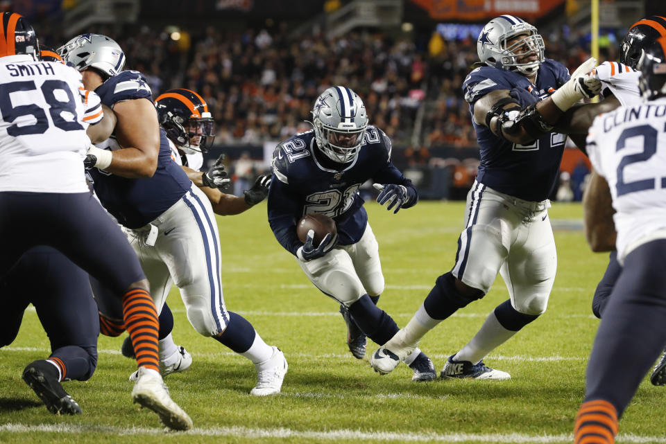 Dallas Cowboys running back Ezekiel Elliott (21) runs for a touchdown during the first half of an NFL football game against the Chicago Bears-, Thursday, Dec. 5, 2019, in Chicago. (AP Photo/Charles Rex Arbogast)