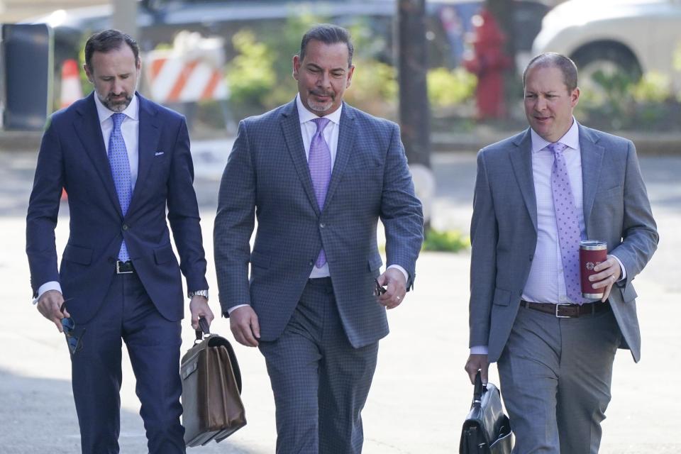 Former DEA agent Joseph Bongiovanni arrives at the Robert H. Jackson U.S. Court House for a hearing for an upcoming trial on drug and bribery charges with his attorneys, Parker R. MacKay, left, and Robert Singer, right, Wednesday, June 21, 2023. The veteran U.S. Drug Enforcement Administration agent is on trial in Buffalo, N.Y., on charges he took $250,000 in bribes from the Mafia to derail investigations and keep his childhood friends out of prison. (Derek Gee/The Buffalo News via AP)