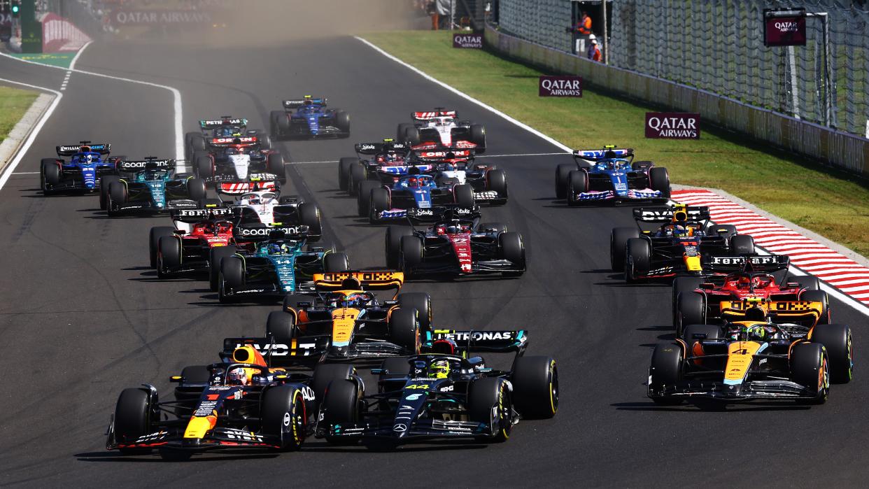  Max Verstappen of the Netherlands driving the (1) Oracle Red Bull Racing RB19 leads the pack through the first corner at the F1 Hungarian Grand Prix. 