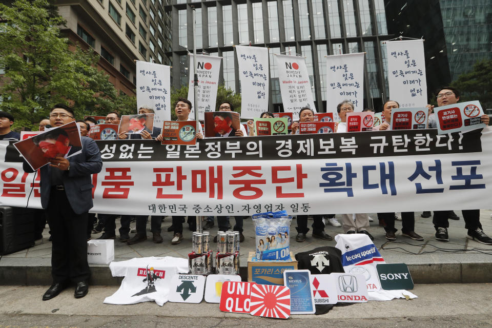 In this July 15, 2019, photo, South Korean small and medium-sized business owners stage a rally calling for a boycott of Japanese products in front of the Japanese embassy in Seoul, South Korea. Seoul has accused Tokyo of weaponizing trade to retaliate against South Korean court rulings calling for Japanese companies to offer reparations to South Koreans forced into slave labor during World War II. Sales of Japanese beer, clothes and other goods have declined sharply as have travels to Japan amid boycott campaigns. The signs read: "Our supermarket does not sell Japanese products." (AP Photo/Ahn Young-joon)