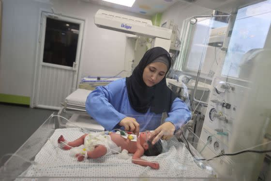 Medical personnel checks a newborn at Nasser Hospital, born after his mother was killed in an Israeli airstrike in Khan Yunis, Gaza on October 24, 2023. The Palestinian doctor said the baby is now in stable condition.<span class="copyright">Mustafa Hassona—Anadolu/Getty Images</span>