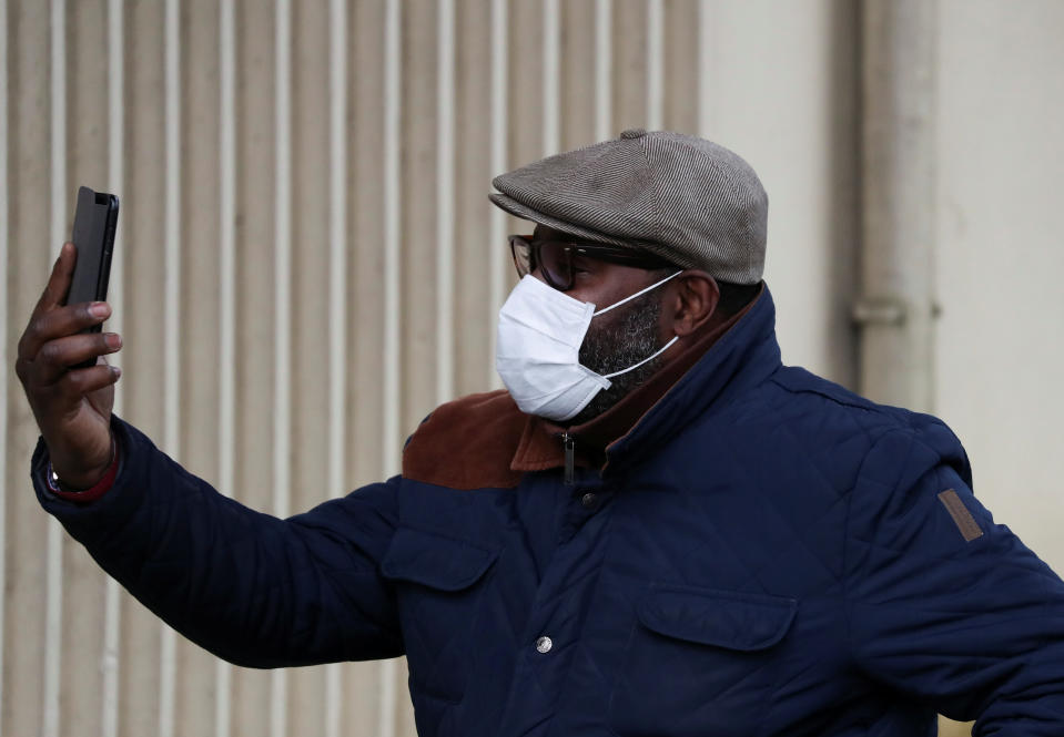 A man wearing a mask leaves Creil's hospital, where people tested positive for coronavirus have been treated, France, February 27, 2020. REUTERS/Yves Herman