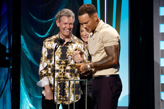 <p>Jason Kempin/Getty</p> Randy Travis, Mary Travis and Kane Brown at the ACM Honors on Aug. 23, 2023, in Nashville