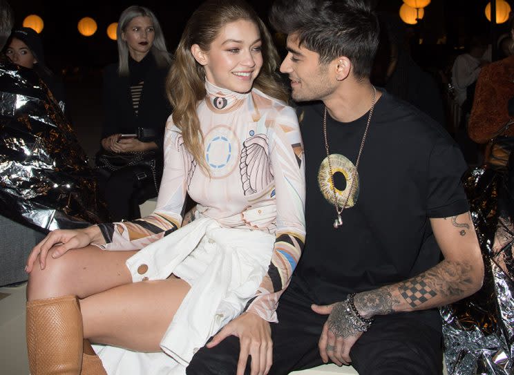 Gigi Hadid and Zayn Malik had hearts in their eyes while sitting front row at the Givenchy presentation during Paris Fashion Week. And it wasn't because of the clothes! (Photo: Stephane Cardinale - Corbis/Corbis via Getty Images)