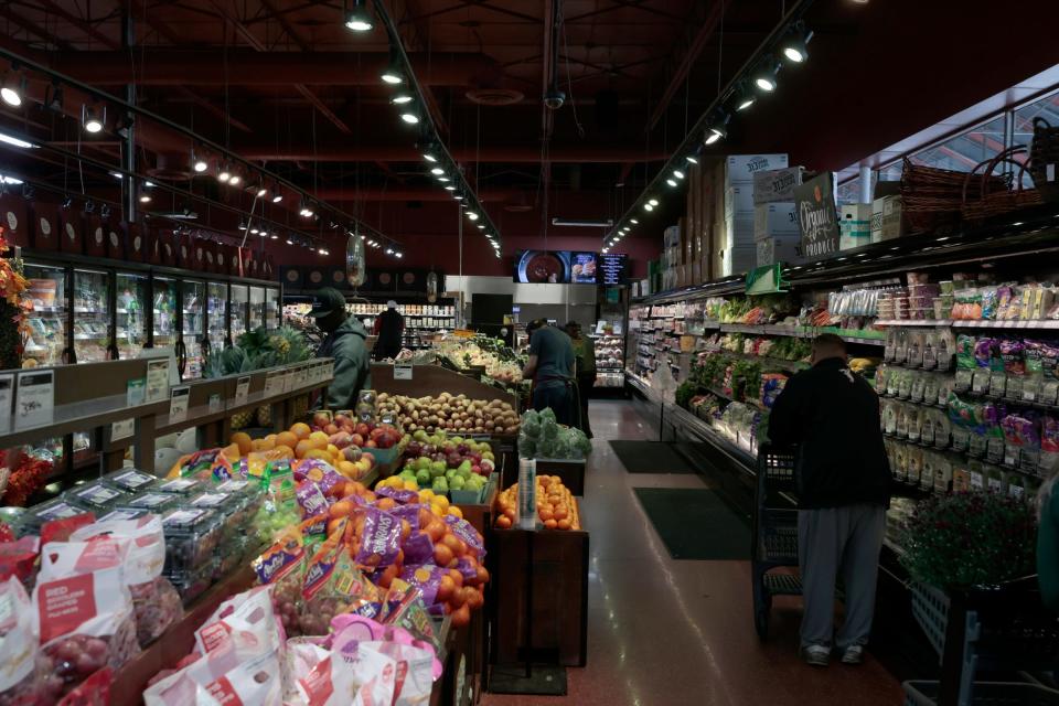 People shop for produce inside Western Market on Nine Mile Road in Ferndale on Saturday, Oct. 7, 2023. The popular grocery store is celebrating its 40th anniversary in business this year and is known for its prepared foods, butcher department and a variety of other items that many big box grocery stores do not carry.