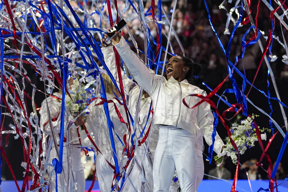 Simone Biles and the U.S. women celebrate as the 2024 team is named at the United States Gymnastics Olympic Trials on Sunday, June 30, 2024, in Minneapolis. (AP Photo/Abbie Parr)