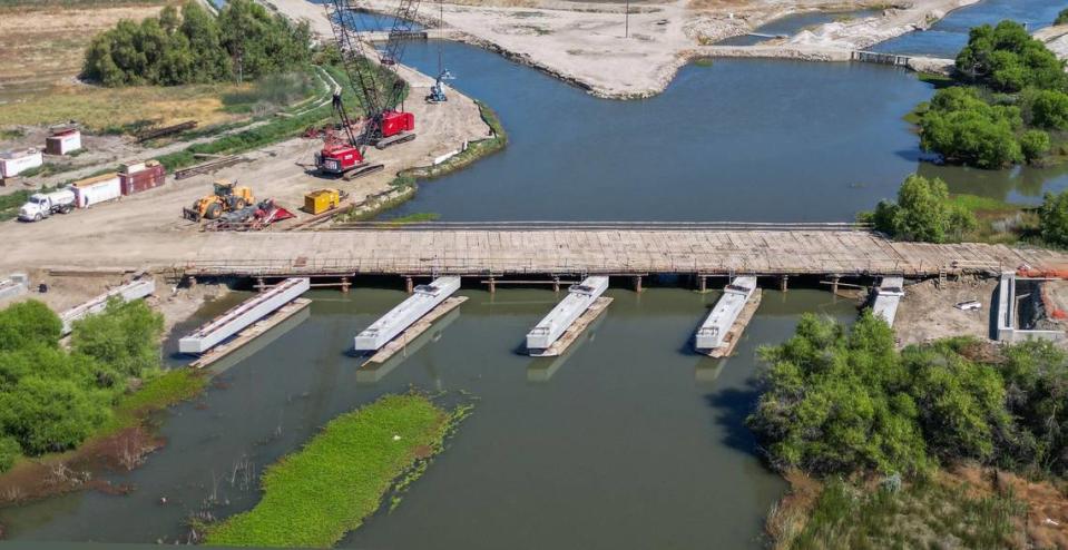 The six new precast pier caps are shown in place on the new Kings River bridge on Highway 41 near Stratford in Kings County in this drone image on Thursday, May 16, 2024.