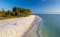 <p>Just off the coast of Fort Myers, <a rel="nofollow noopener" href="http://www.travelandleisure.com/trip-ideas/vacationing-sanibel-island-florida" target="_blank" data-ylk="slk:Sanibel Island;elm:context_link;itc:0;sec:content-canvas" class="link ">Sanibel Island</a> benefits from its rare east-west orientation by being a natural repository for seashells. So many seashells, in fact, that there’s a verb for collecting them here: the Sanibel Stoop. Forward-thinking residents enacted regulations in the mid-20th century that spared the island from sprawl and overdevelopment so common in the rest of the state. Today, fully two-thirds of the island is protected land, including the alligator-filled J.N. “Ding” Darling National Wildlife Refuge.</p>