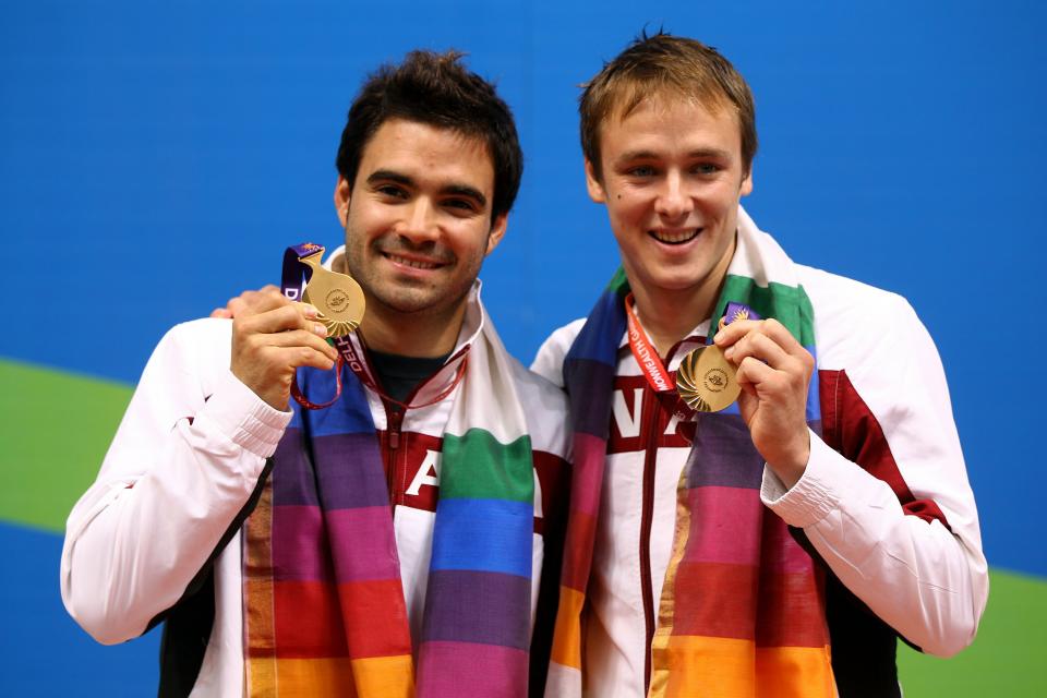 DELHI, INDIA - OCTOBER 12: Alexandre Despatie and Reuben Ross of Canada pose with the gold medals won in the Men's 3m Synchro Springboard Final at Dr. S.P. Mukherjee Aquatics Complex on day nine of the Delhi 2010 Commonwealth Games on October 12, 2010 in Delhi, India. (Photo by Feng Li/Getty Images)