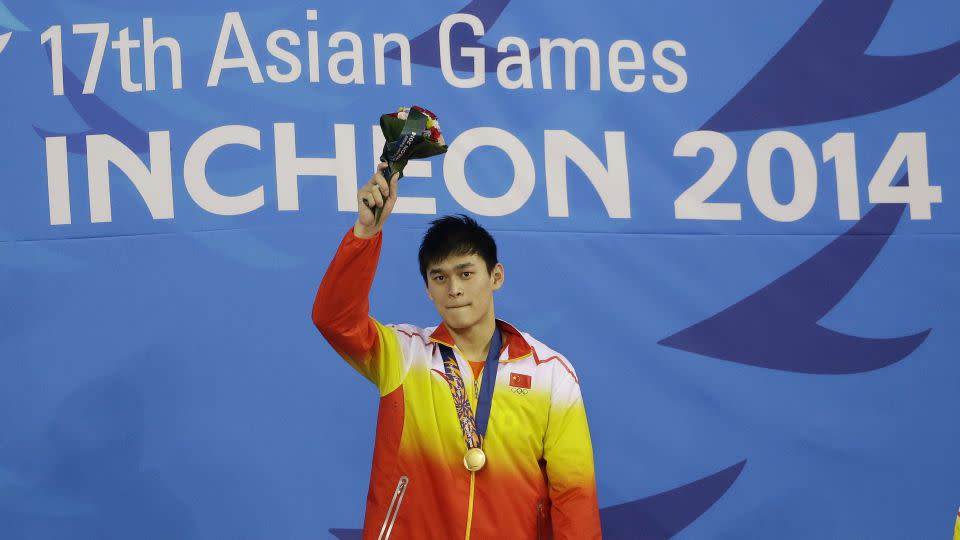 China's Sun Yang waves after receiving his gold medal in the men's 1500-meter freestyle swimming final at the 17th Asian Games in Incheon, South Korea, Friday, Sept. 26, 2014. - Lee Jin-man/AP