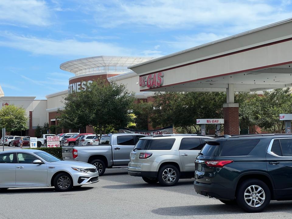 Cars line up to refuel at the members-only BJ's Wholesale gas station in Port Orange on Saturday, Aug. 6, 2022.