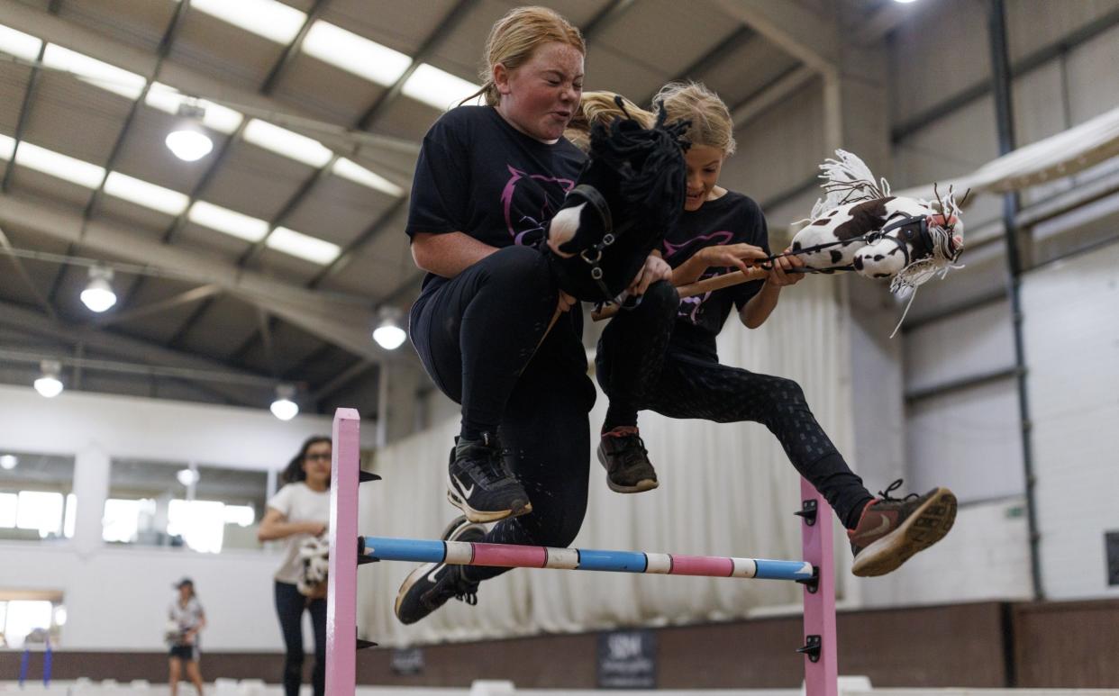 Competitors practice their moves before taking part in the UK Hobby Horse championship