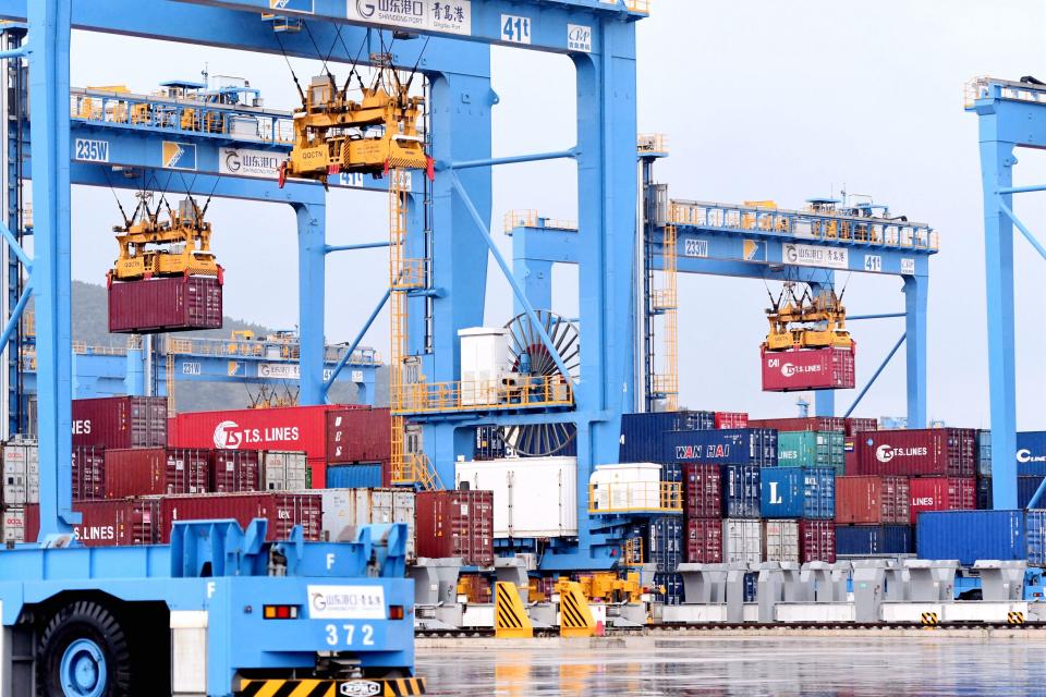 QINGDAO, CHINA - SEPTEMBER 19, 2021 - Bridge cranes load and unload foreign trade containers automatically at Qingdao Port automation Terminal in Qingdao, East China's Shandong Province, Sept. 19, 2021. (Photo credit should read Yu Fangping / Costfoto/Barcroft Media via Getty Images)