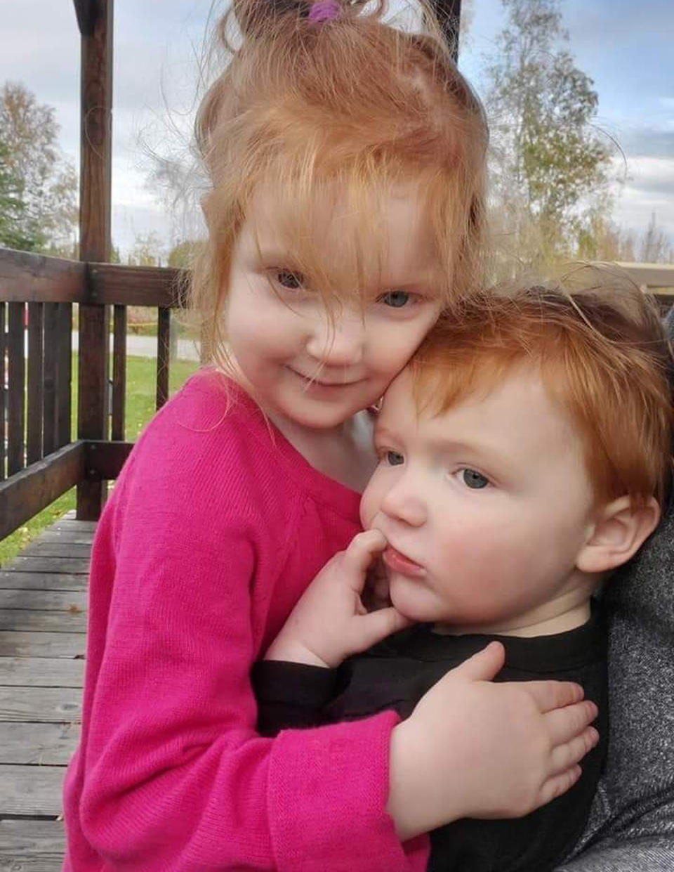 This undated photo provided by Rebecca Knight in April 2020 shows her daughter, Nova, with her little brother, Colton, at their home in Fairbanks, Alaska. The 5-year-old Alaska girl is producing videos teaching other children how to be safe during the coronavirus pandemic, including encouraging them to skip their play dates, stay home, wash their hands and telling them to cough into their elbow to prevent the spread of germs. (Rebecca Knight via AP)