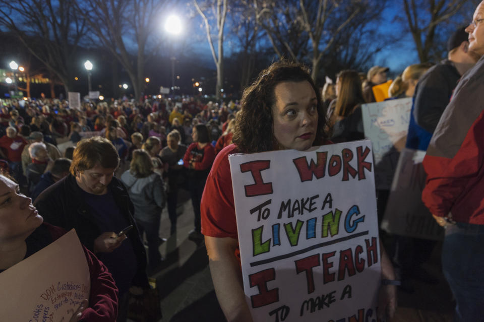 <p>Annie Hancock, a teacher from Jackson County, holds her sign outside of the capitol building after WVEA President Dale Lee outlined the terms for ending the walkout on the fourth day of statewide walkouts in Charleston, W.Va., on Tuesday, Feb. 27, 2018. (Photo: Craig Hudson/Charleston Gazette-Mail via AP) </p>