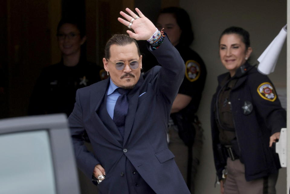 Actor Johnny Depp gestures as he leaves the Fairfax County Circuit Courthouse following his defamation trial against his ex-wife Amber Heard, in Fairfax, Virginia, U.S., May 27, 2022. REUTERS/Evelyn Hockstein