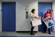 <p>Salvadoran immigrants Mirna Portillo and Rosa Romero wait for an elevator after a news conference at the New York Immigration Coalition following President Donald Trump’s announcement to end the Temporary Protection Status for Salvadoran immigrants in Manhattan, New York City, Jan. 8, 2018. (Photo: Andrew Kelly/Reuters) </p>