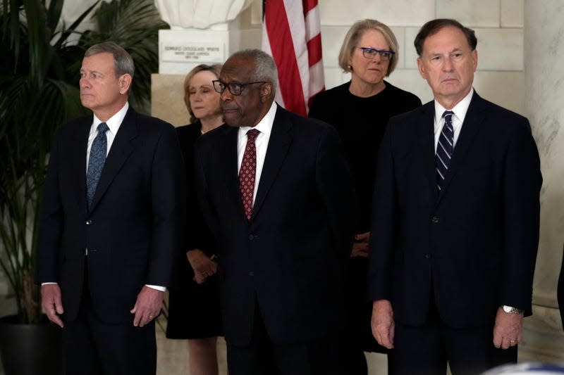 WASHINGTON, DC - DECEMBER 18: Chief Justice of the United States John Roberts, Justice Clarence Thomas and Justice Samuel Alito attend a private ceremony for retired Supreme Court Justice Sandra Day O’Connor. 