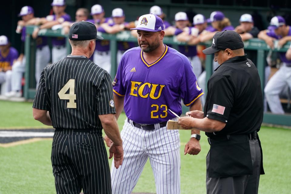 Vanderbilt head coach Tim Corbin (4) and East Carolina head coach Cliff Godwin (23) exchange lineups before an NCAA college baseball super regional game Friday, June 11, 2021, in Nashville, Tenn. (AP Photo/Mark Humphrey)