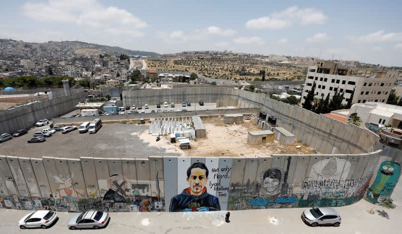 A mural depicting Iyad al-Halaq is seen painted on the Israeli barrier in Bethlehem in the Israeli-occupied West Bank