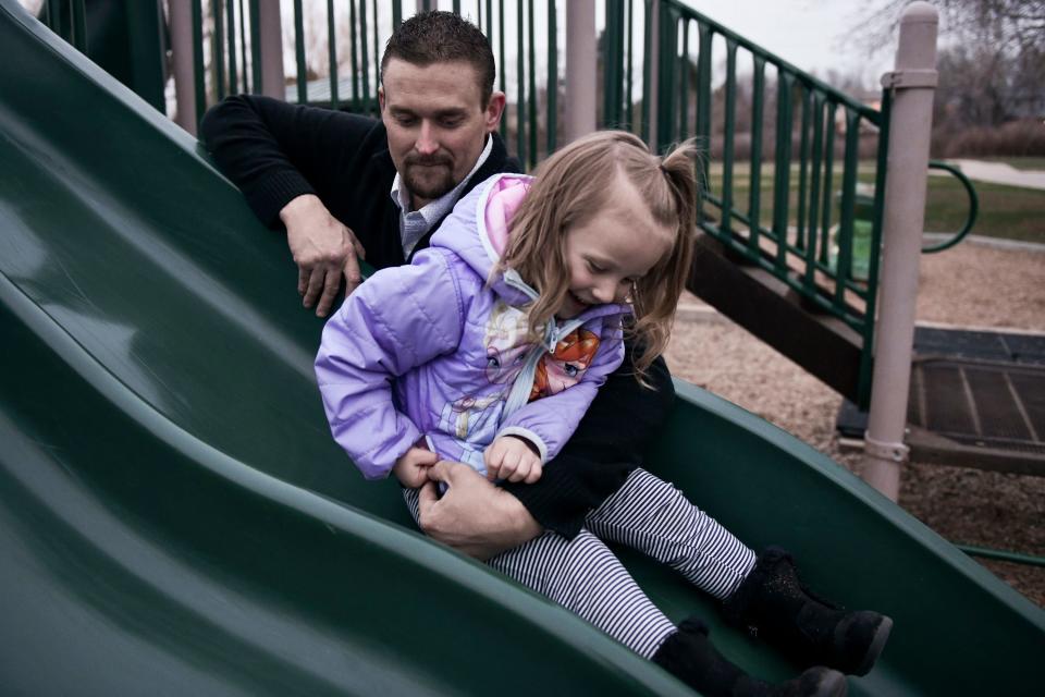 Sean Graves plays with his daughter, Olivia Graves, 3,