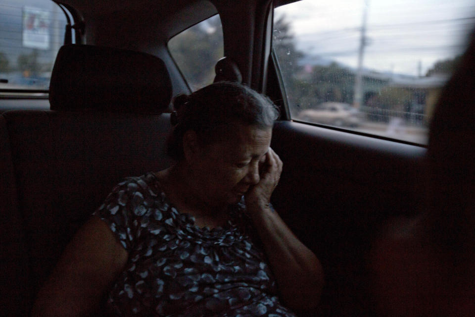 In this Oct. 30, 2018 photo, Haydee Posadas, 73, rides home after giving an interview, in San Pedro Sula, Honduras. Posadas' son fled Honduras for the U.S. in 2010 in part because of gang threats. But en route in Mexico, Wilmer Gerardo Nunez disappeared into the vortex of drug violence that he was trying to escape in the first place. (AP Photo/Moises Castillo)