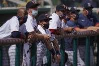 The Minnesota Twins team watches from the dugout during a spring training baseball game against the Boston Red Sox on Sunday, Feb. 28, 2021, in Fort Myers, Fla. (AP Photo/Brynn Anderson)
