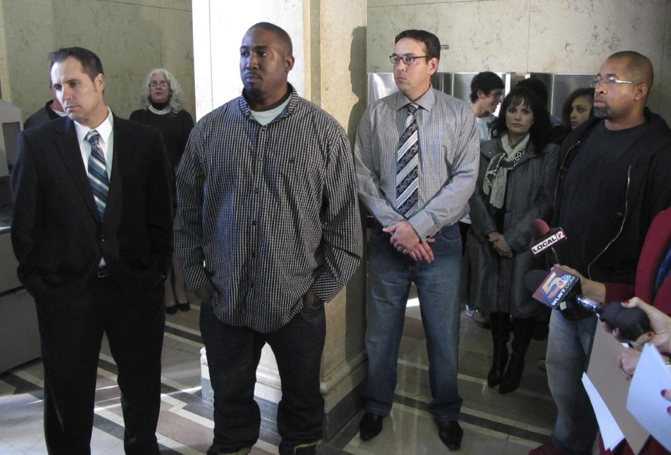 From left to right, Jim Lancaster, 46, of Alexandria, Ky. Damon Robinson, 36, of Lexington, Ky. Micah Morthland, 38, of Highland Heights, Ky. and Mark Hedges, 45, of Cincinnati, stand in the Hamilton County Court of Common Pleas, Monday, Nov. 5, 2012, in Cincinnati shortly after filing a lawsuit against builders of Cincinnati's first and only casino, slated to open in the spring. The men were injured while pouring concrete on a second floor at the casino in January and allege that the construction firms neglected safety to get the project done on time. (AP Photo/Amanda Lee Myers)