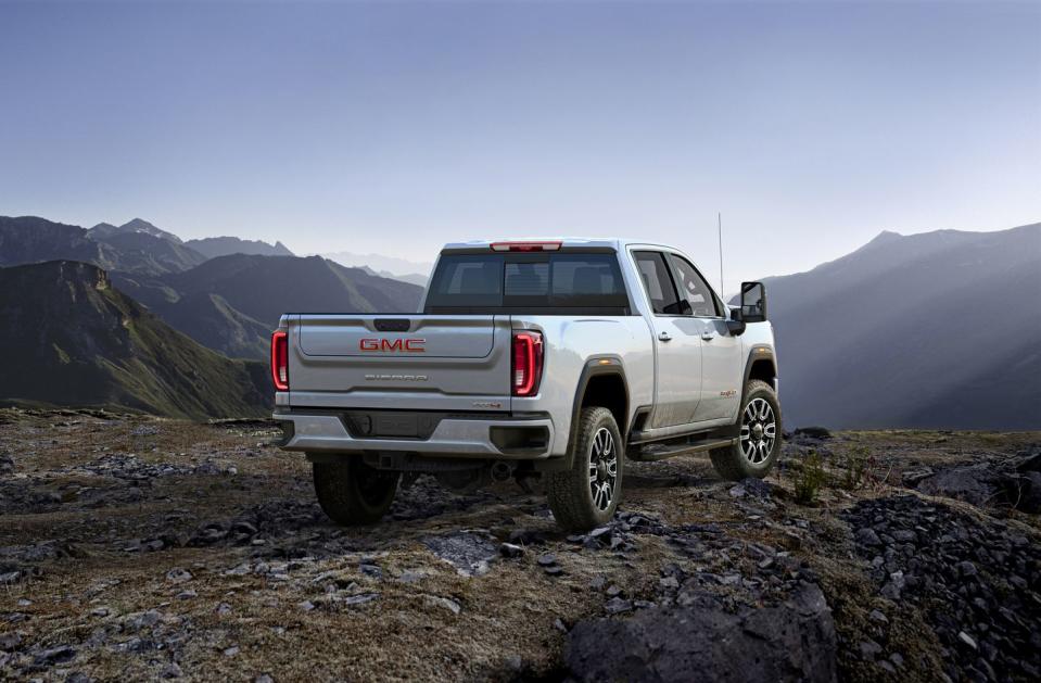 <p>The GMC has extra chrome and in-your-face grille compared with the Chevy, but its 35,500-pound max towing capacity remains intact.</p>