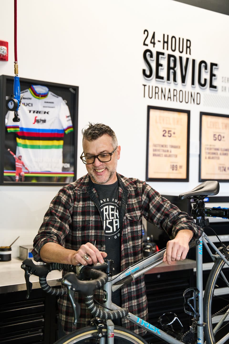 mark taylor working on bike in shop
