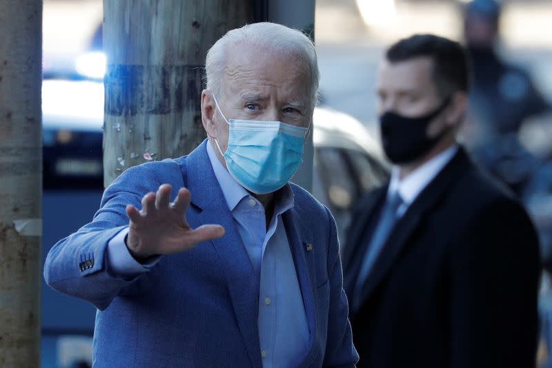 FILE PHOTO: U.S. President-elect Joe Biden walks into the Queen Theatre in Wilmington