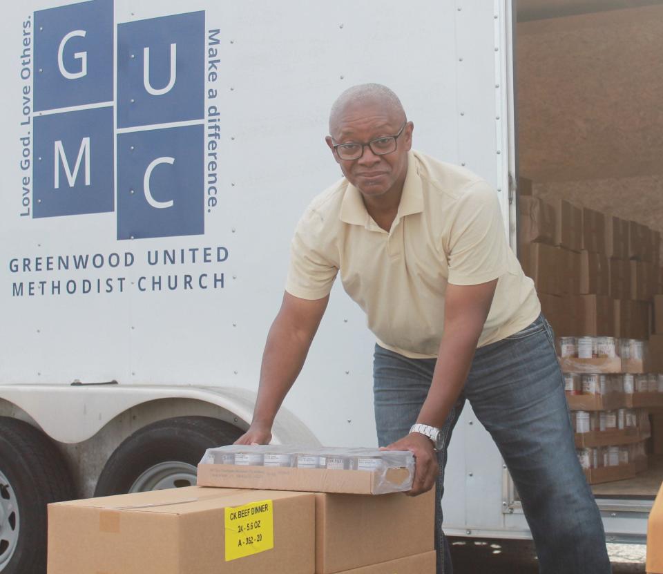 Sylvester Hampton helps load a trailer with food and water for Greenwood, Arkansas flood victims at the River Valley Regional Food Bank on Wednesday, June 15, 2022 in Fort Smith.
