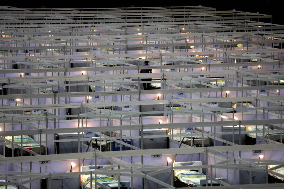 FILE - Hundreds of beds are lined up at a temporary field hospital set up at the Asia World Expo in Hong Kong, Saturday, Aug. 1, 2020. (AP Photo/Kin Cheung, File)