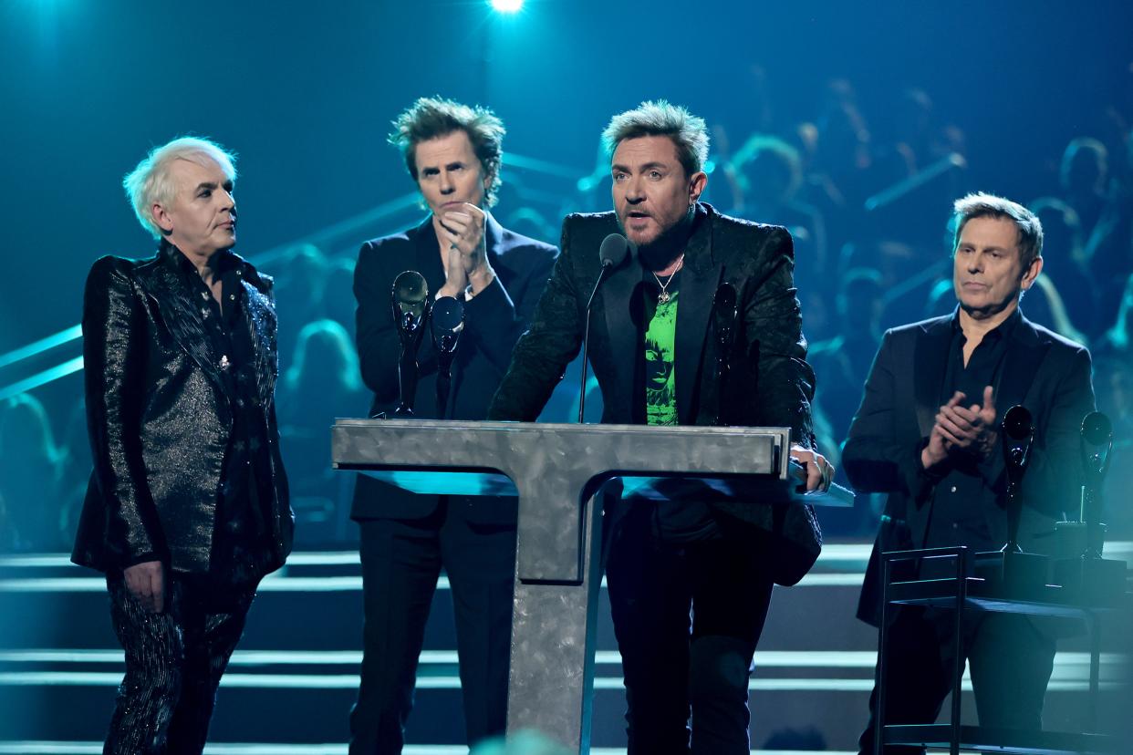 Inductees Nick Rhodes, John Taylor, Simon Le Bon and Roger Taylor of Duran Duran speak onstage during the Rock & Roll Hall of Fame induction ceremony.