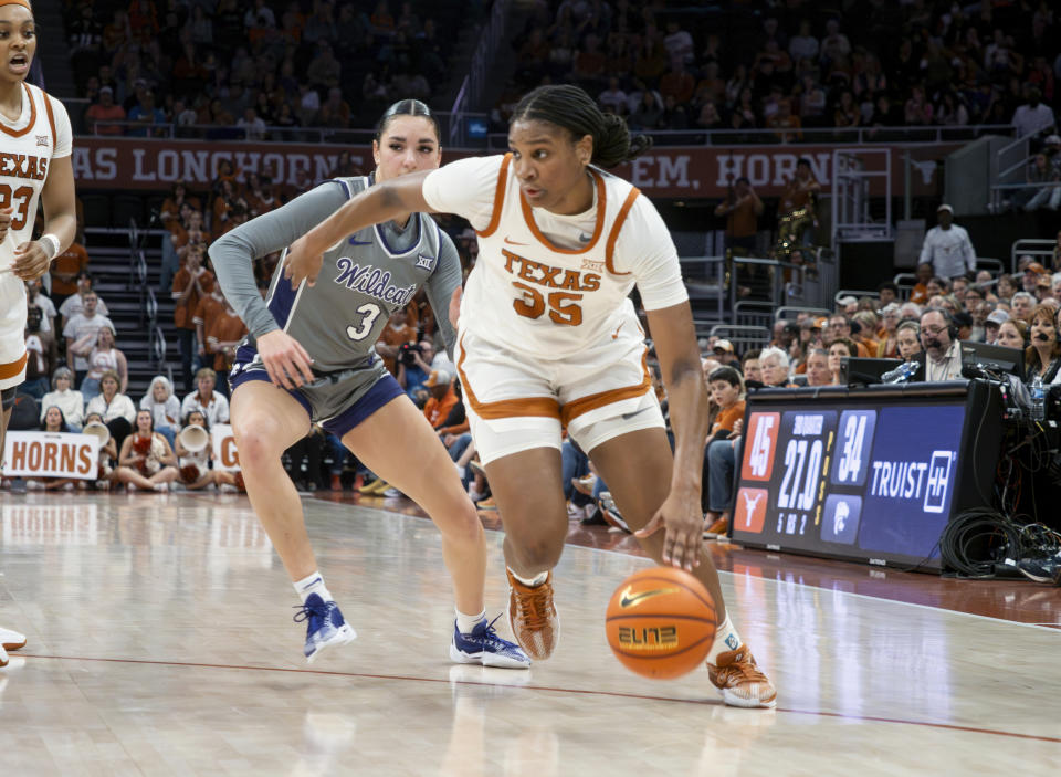 Texas guard Madison Booker (35) drives the ball against Kansas State guard Jaelyn Glenn (3) during the second half of an NCAA college basketball game, Sunday, Feb. 4, 2024, in Austin, Texas. (AP Photo/Michael Thomas)