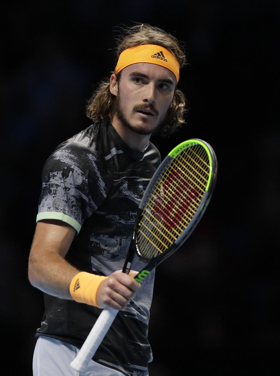 Stefanos Tsitsipas of Greece celebrates winning the first set against Roger Federer of Switzerland during their ATP World Tour Finals semifinal tennis match at the O2 Arena in London, Saturday, Nov. 16, 2019. (AP Photo/Kirsty Wigglesworth)