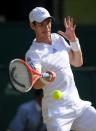 Great Britain's Andy Murray in action against Serbia's Novak Djokovic on day thirteen of the Wimbledon Championships at The All England Lawn Tennis and Croquet Club, Wimbledon.