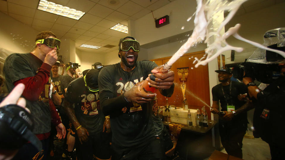 LeBron James enjoys himself some bubbly. (Getty Images)