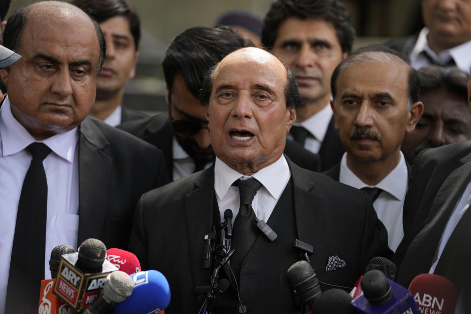 Latif Khosa, center, a lawyer of Pakistan's former Prime Minister Imran Khan's legal team, speaks with media outside a court after Khan's appeal hearing, in Islamabad, Pakistan, Wednesday, Aug. 9, 2023. A top Pakistani court Wednesday said it wanted to hear from the government before deciding over the imprisonment of former Prime Minister Imran Khan on corruption charges. Khan was arrested at his Lahore home on Saturday and given a three-year jail sentence on charges of concealing assets. He is held at the high-security prison Attock while his legal team seeks his release. (AP Photo/Anjum Naveed)