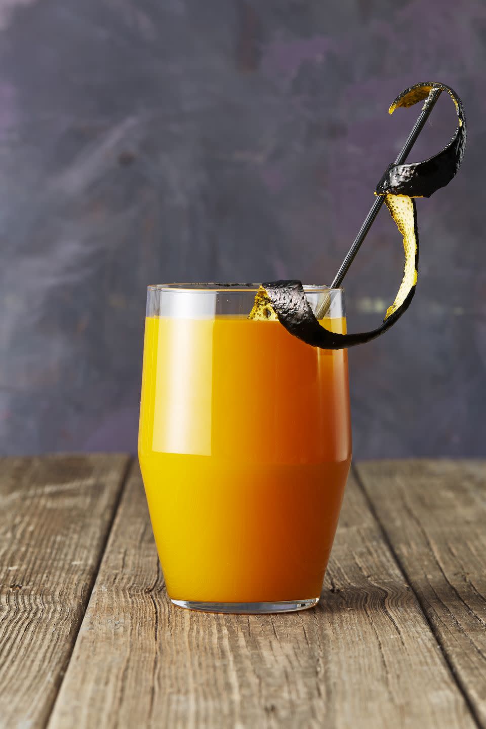 <p>Garnish this party potion the Halloween way by painting orange peel strips with black gel food coloring. </p><p>Get the <a href="https://www.goodhousekeeping.com/food-recipes/a46066/apricot-bourbon-brew-recipe/" rel="nofollow noopener" target="_blank" data-ylk="slk:Apricot Bourbon Brew recipe;elm:context_link;itc:0;sec:content-canvas" class="link "><strong>Apricot Bourbon Brew recipe</strong></a>.<br></p>