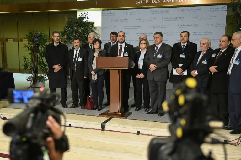 Syria's main opposition High Negotiations Committee (HNC) leader Nasr al-Hariri gives a press conference next to delegates during the Intra-Syrian peace talks at the European headquarters of the United Nations in Geneva, on March 3, 2017