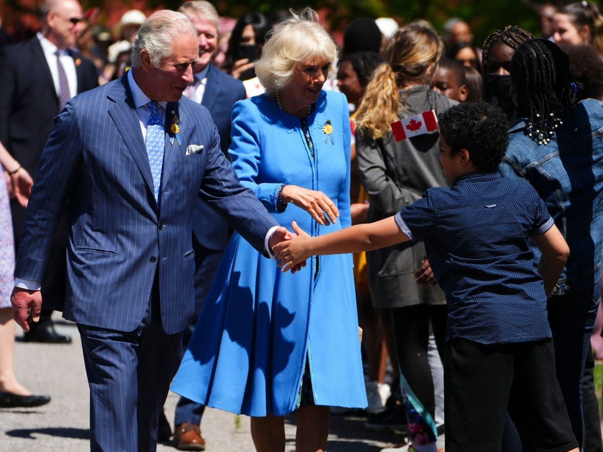 Prince Charles and Camilla, Duchess of Cornwall, visit Assumption Catholic School in Ottawa, while on their 2022 Royal Tour to Canada, on May 18. (Sean Kilpatrick/The Canadian Press - image credit)