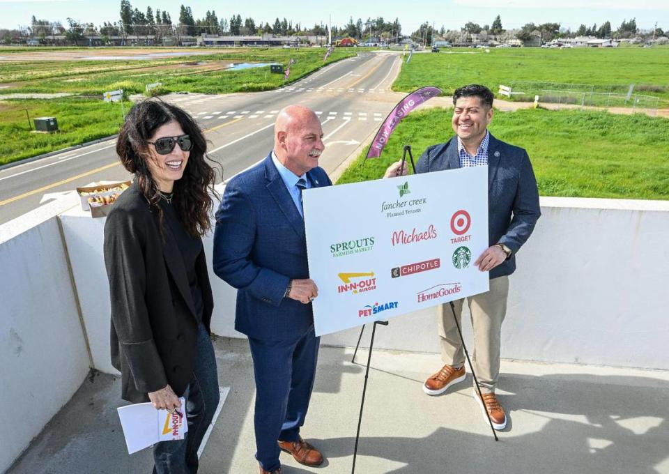 Tracy Kashian, left, vice president of marketing/public relations at Lance-Kashian & Co., stands with Fresno Mayor Jerry Dyer and City Councilmember Luis Chavez while announcing future tenants at the new Fancher Creek Town Center in southeast Fresno.