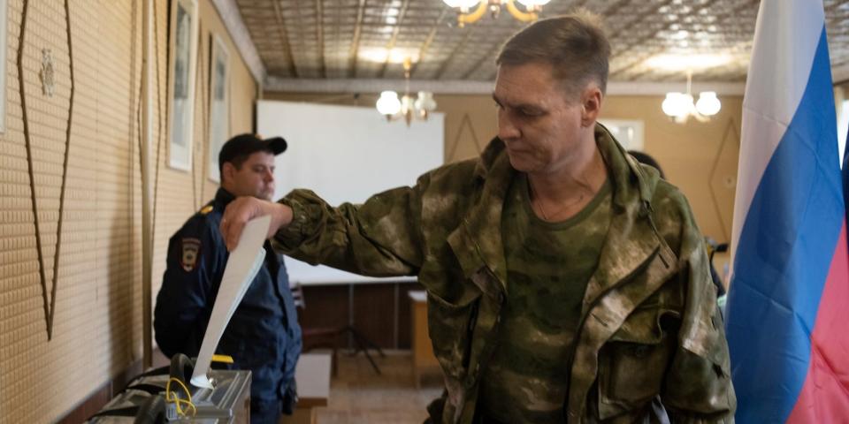 A Luhansk People's Republic serviceman votes in a polling station in Luhansk People's Republic, which is controlled by Russia-back separatists, on September 23, 2022.