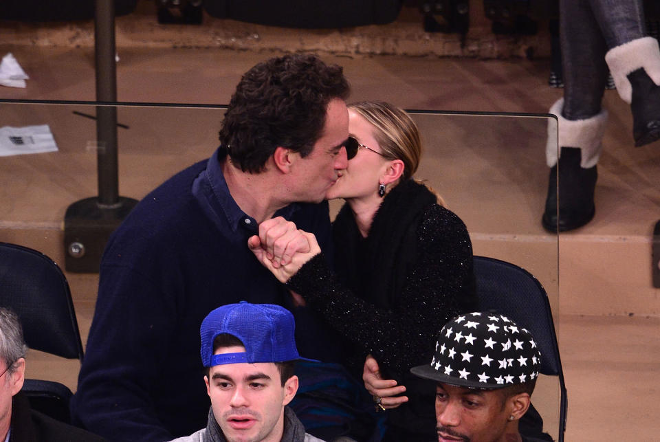 Olivier Sarkozy and Mary-Kate Olsen attend the Atlanta Hawks vs New York Knicks game at Madison Square Garden on December 14, 2013 in New York City. 