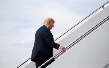 U.S. President Donald Trump boards Air Force One to travel to a campaign rally in West Virginia from Joint Base Andrews, Maryland, U.S. August 21, 2018.  REUTERS/Leah Millis