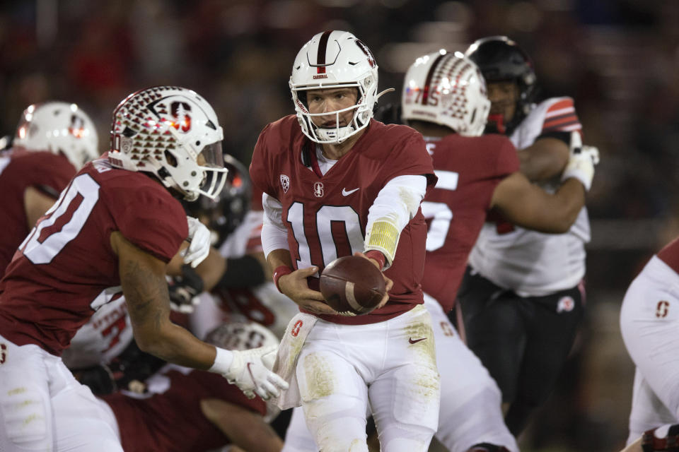 Stanford quarterback Jack West (10) hands off to running back Austin Jones (20) during the second quarter of the team's NCAA college football game against Utah, Friday, Nov. 5, 2021, in Stanford, Calif. (AP Photo/D. Ross Cameron)