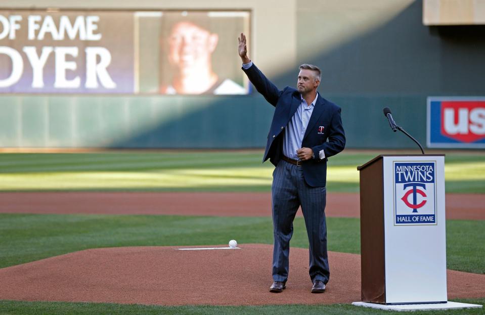 Former Minnesota Twin Michael Cuddyer waves to fans after his induction into the Twins Hall of Fame, prior to a baseball game between the Twins and the Arizona Diamondbacks on Saturday, Aug. 19, 2017, in Minneapolis.