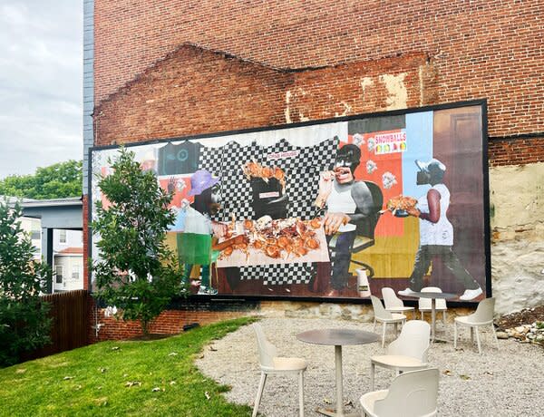 A mural by Baltimore artist SHAN Wallace overlooks Good Neighbor’s outdoor space.